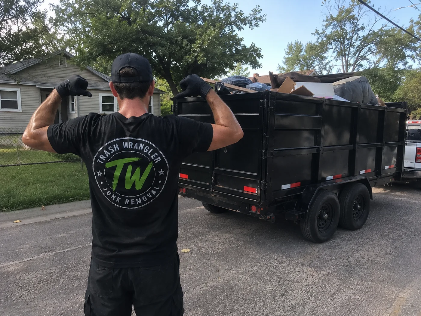 Trash Wrangler junk removal in Nicoma Park, OK — Casey with a fully loaded dump trailer