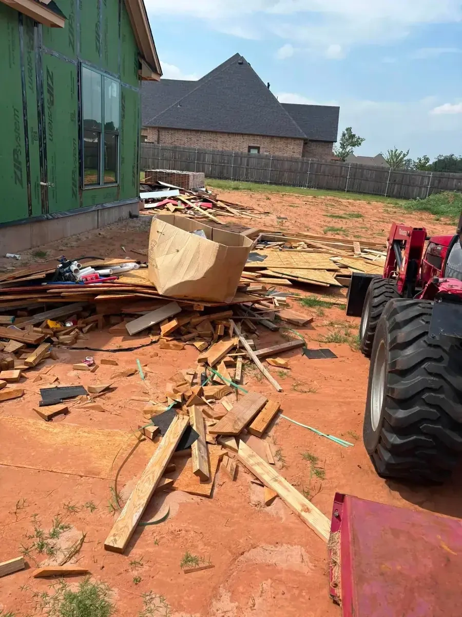 Job site construction waste and building debris hauled by Trash Wrangler — OKC metro